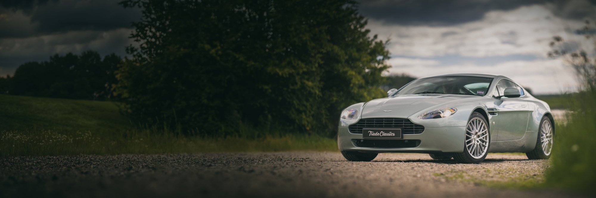 Aston Martin V8 Vantage on a country road